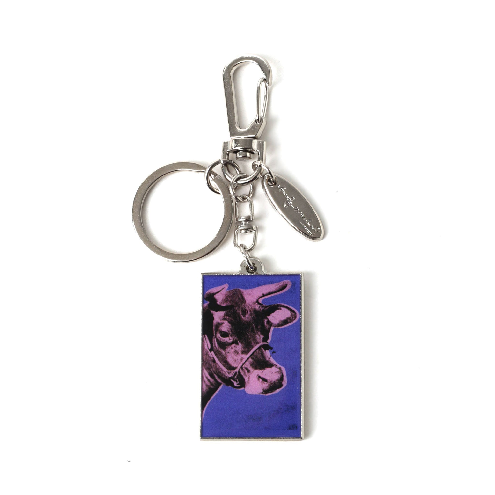 Keychain with a purple cow design on a white background