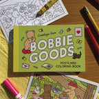 “Bobbie Goods postcard coloring pages with crayons and colored example”