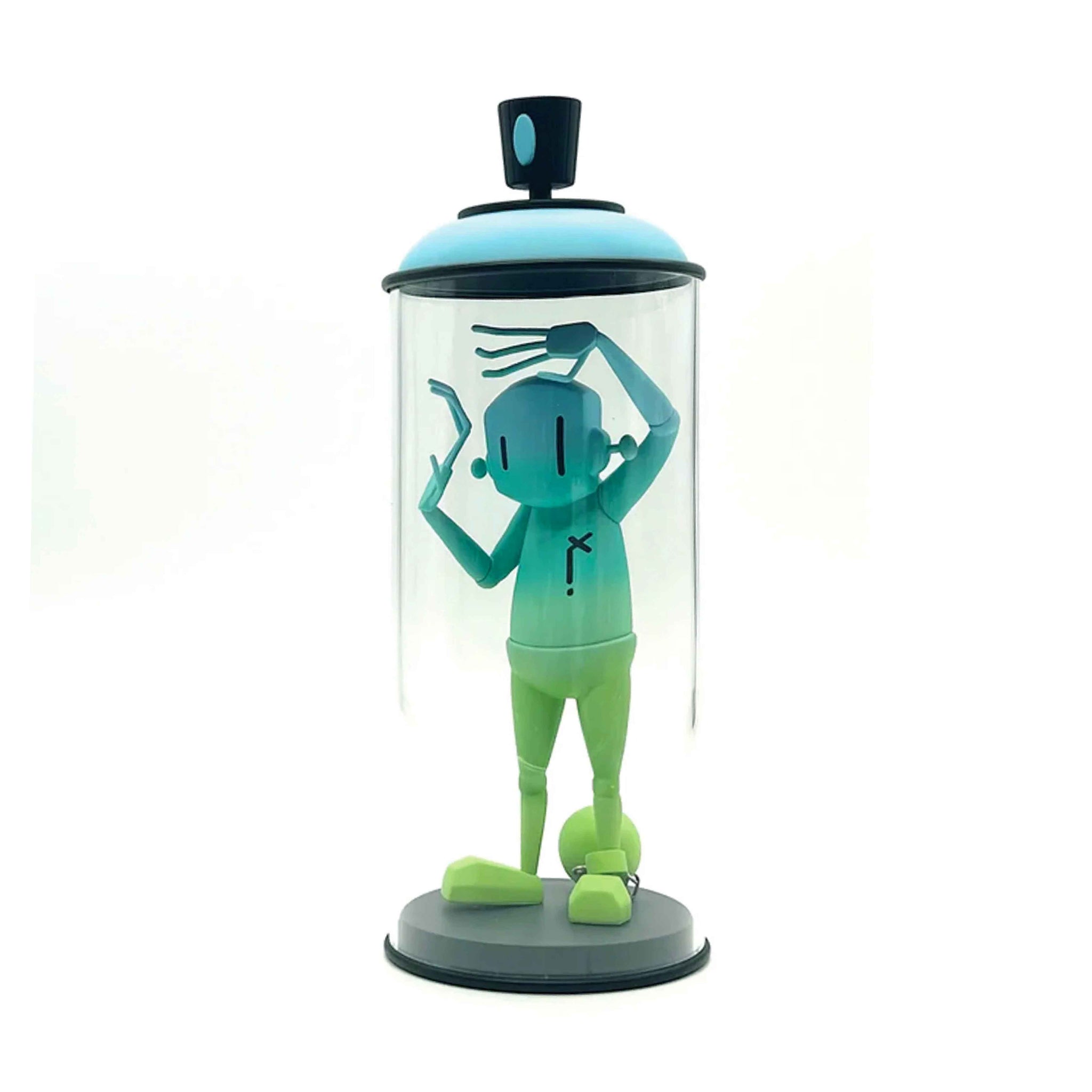 Green character figurine inside a transparent cylindrical container with a black lid on a white background