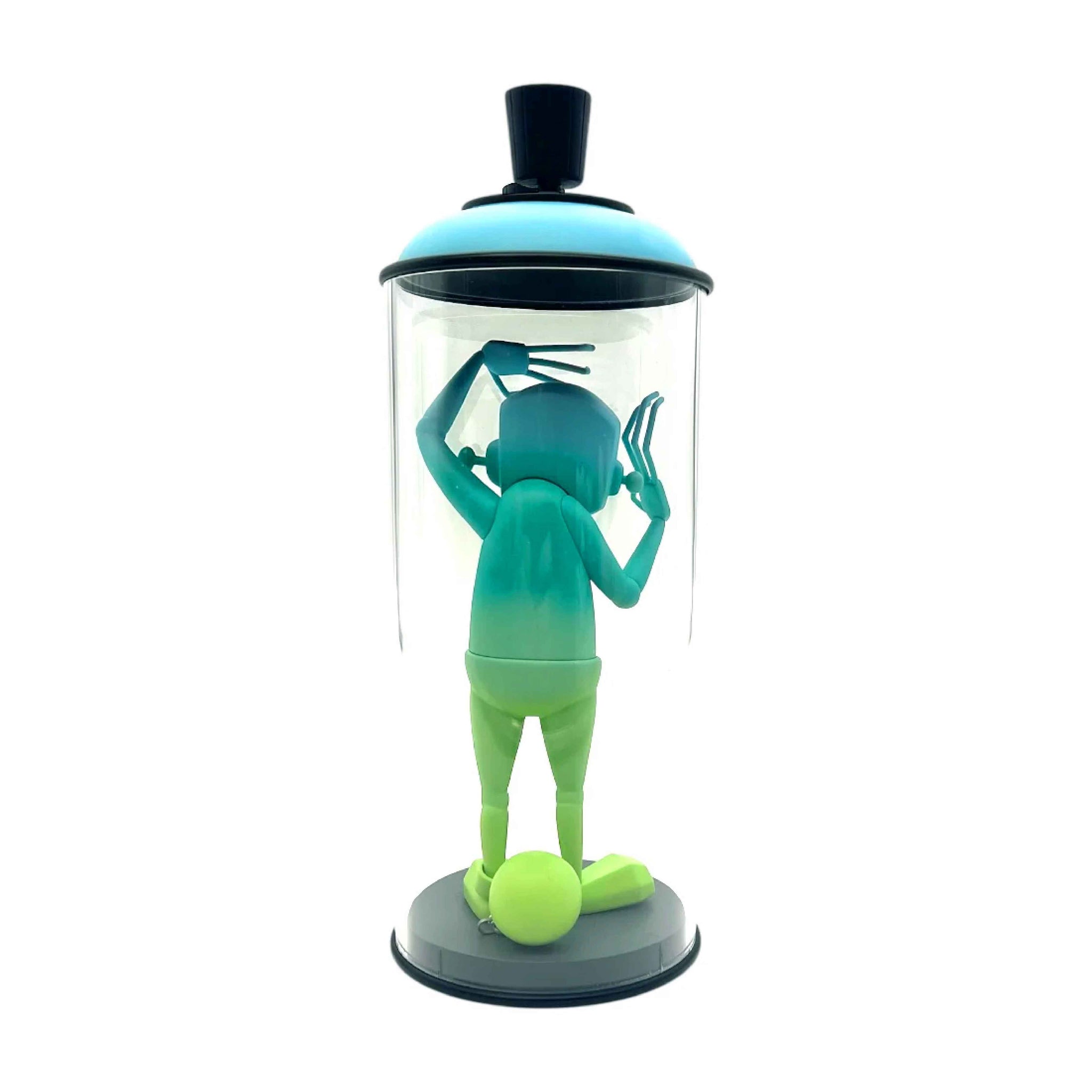 Green and blue character inside a transparent dome with black lid on a white background