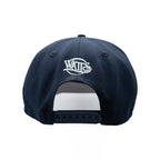 Navy blue cap with a white logo on the back against a white background