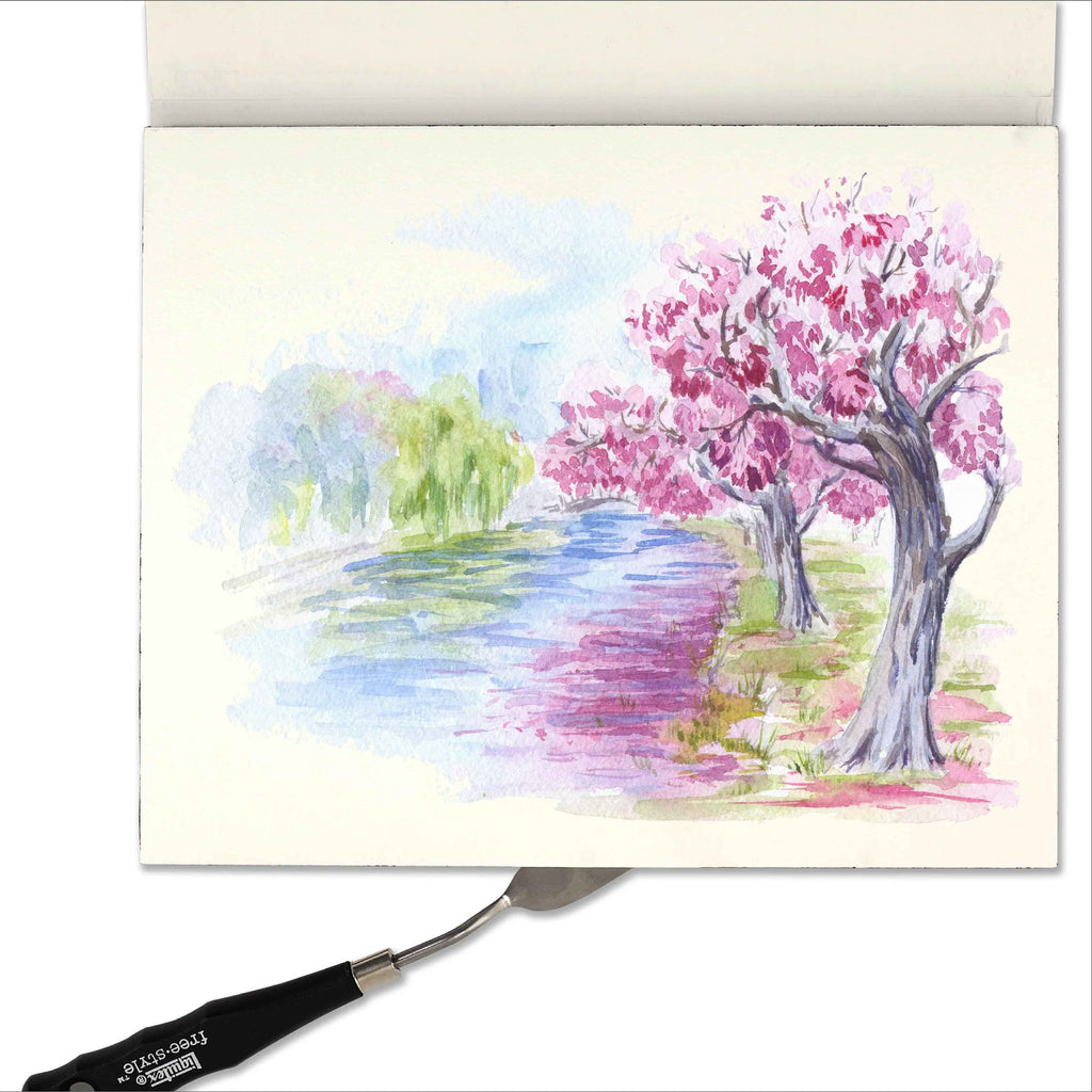 Example of a colorful illustration of a cherry blossom tree on a piece of paper with a paintbrush.