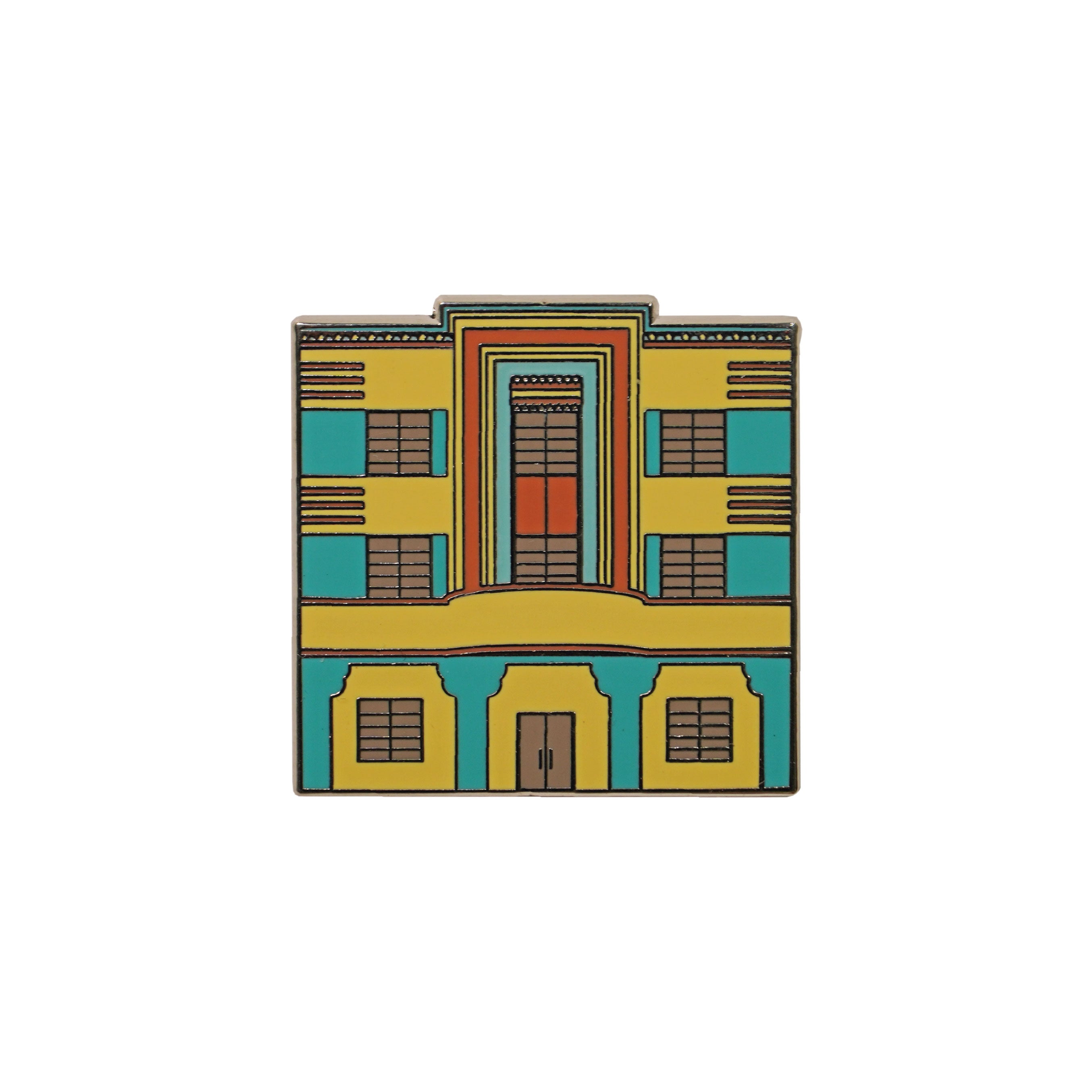 Colorful enamel pin shaped like an Art Deco building in yellow, teal, and orange
