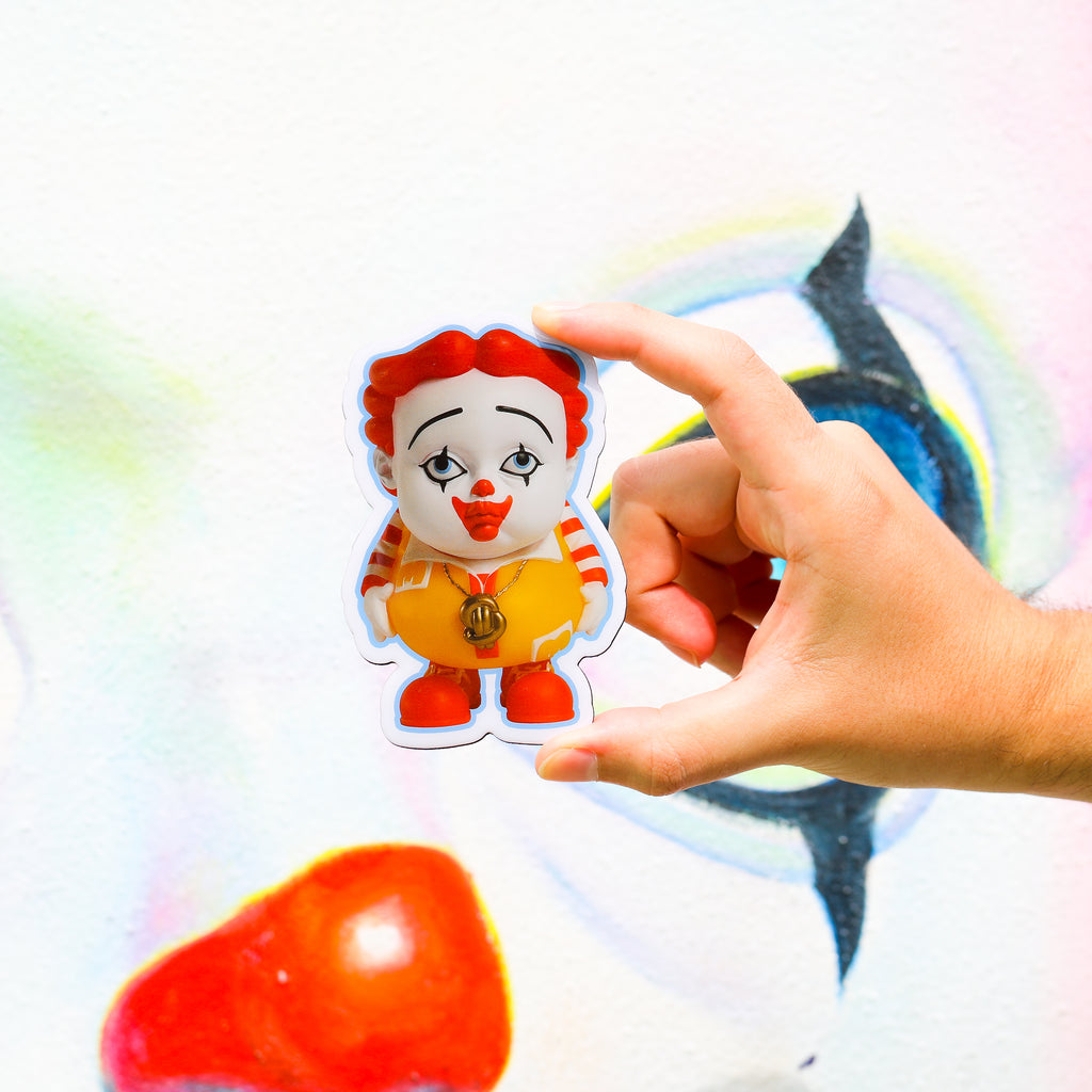 Close-up of YOUNG MC magnet with red hair clown face gold chain