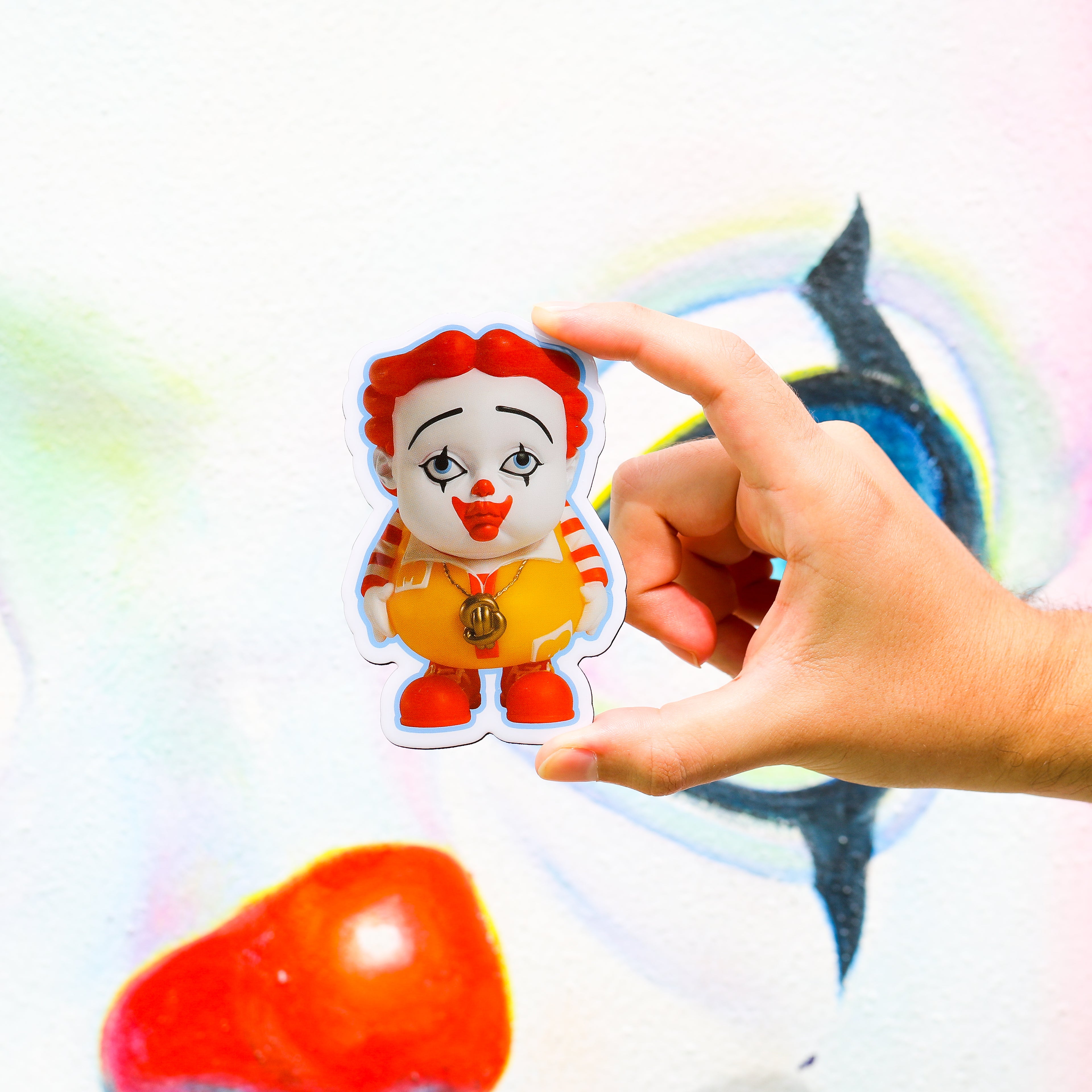 Close-up of YOUNG MC magnet with red hair clown face gold chain